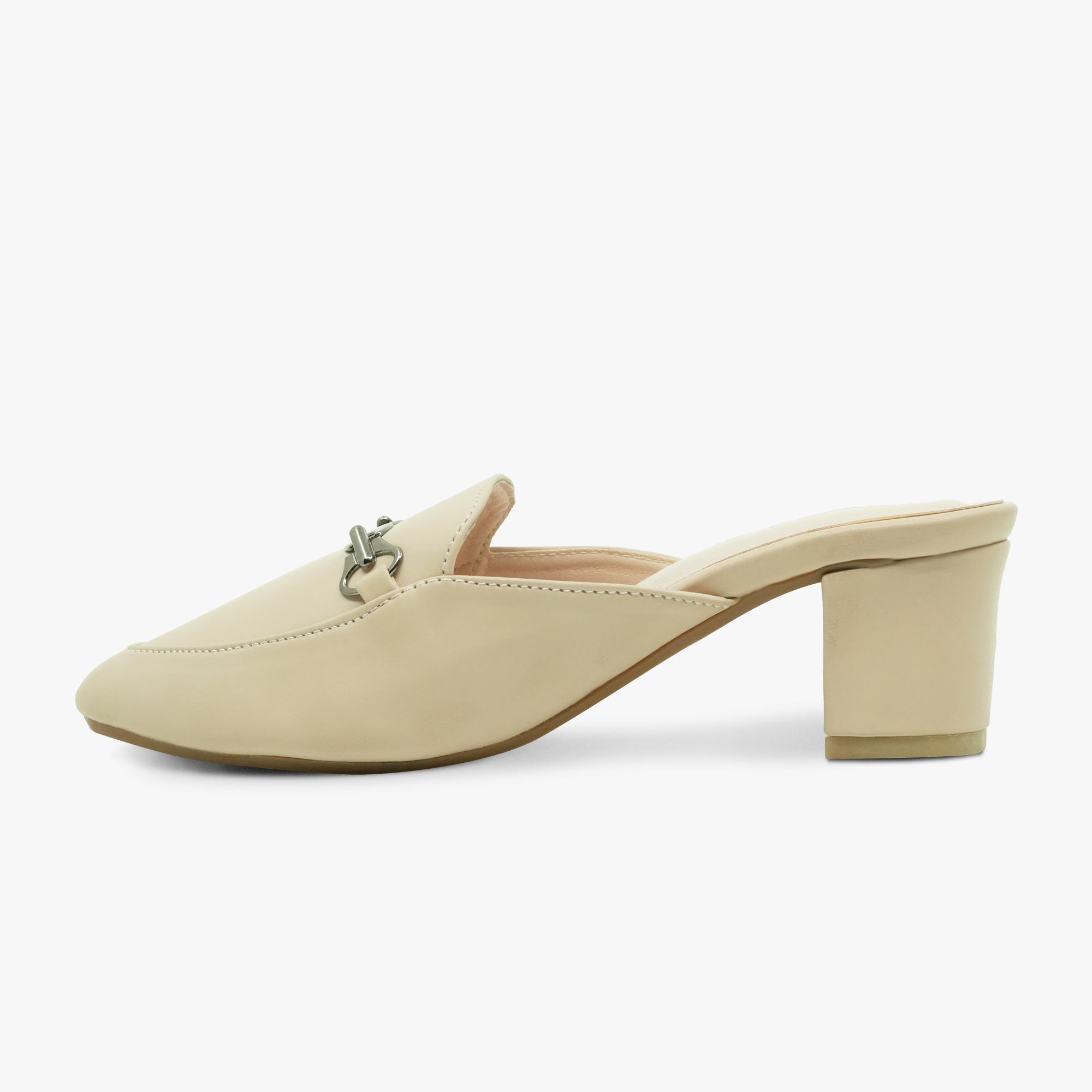 “Profile shot of closed-toe beige mule featuring metal horsebit accent”