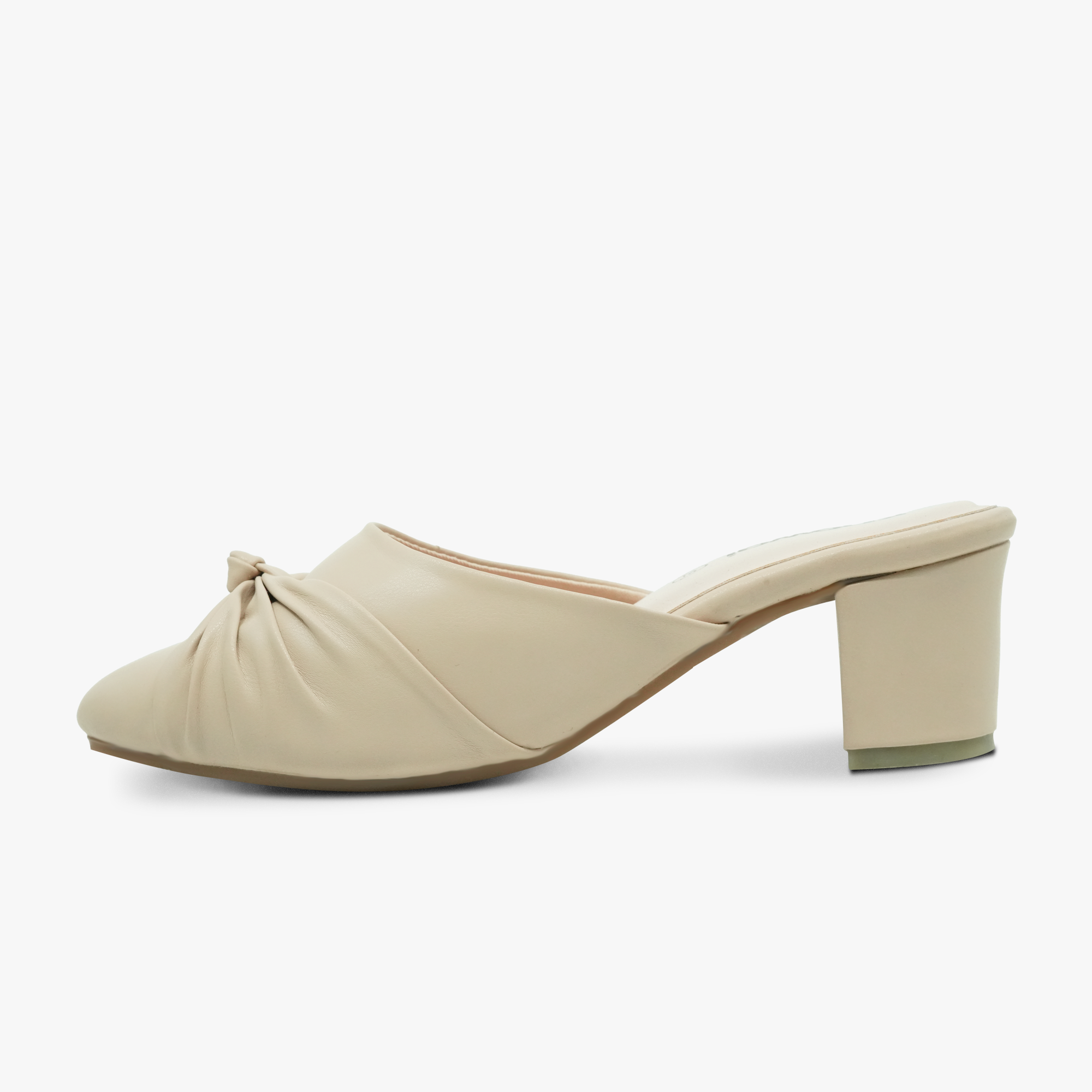 “Profile shot of Khowai beige mule pumps featuring a twisted knot vamp”