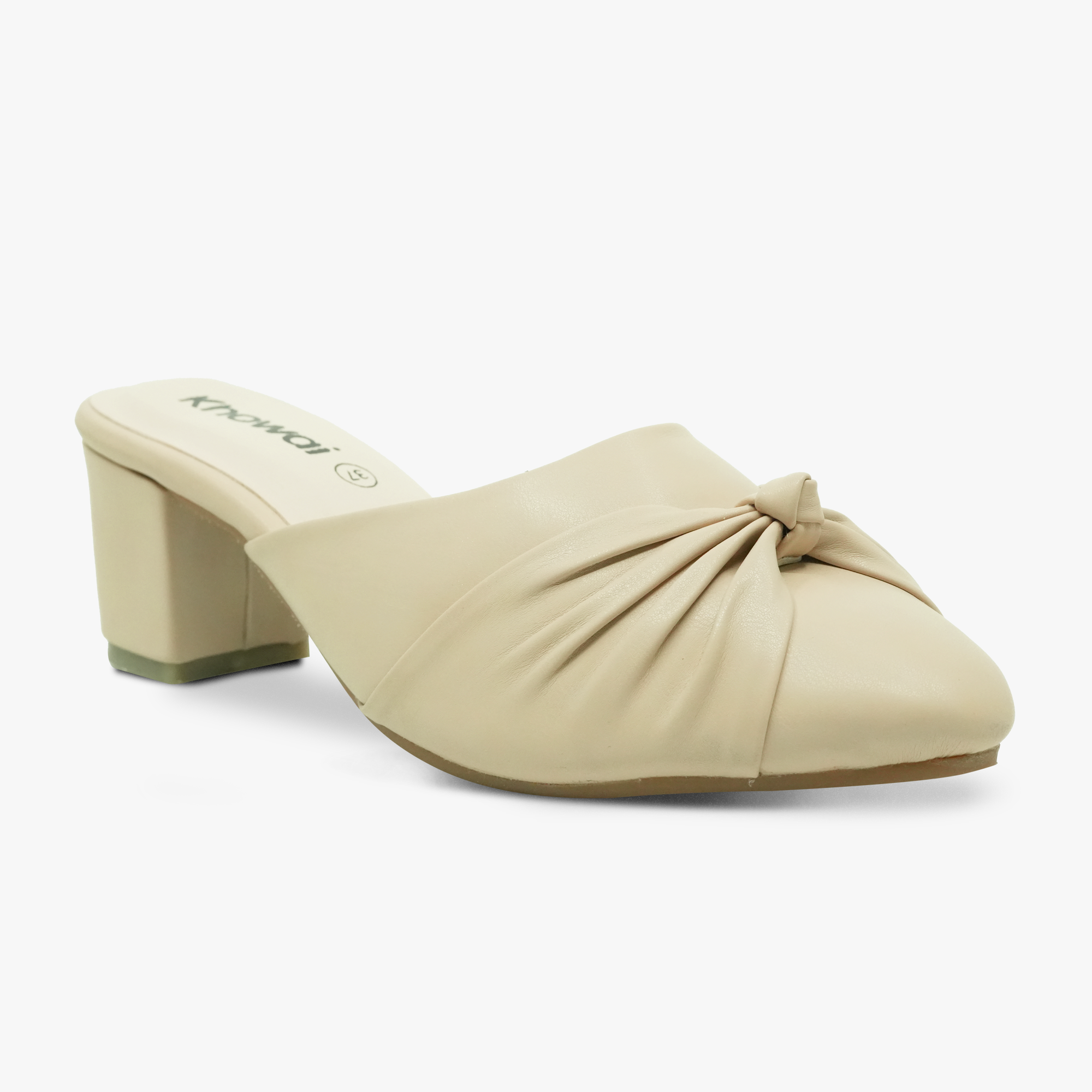 “Front angle of Khowai beige slip-on mules showing closed toe and knot detail”