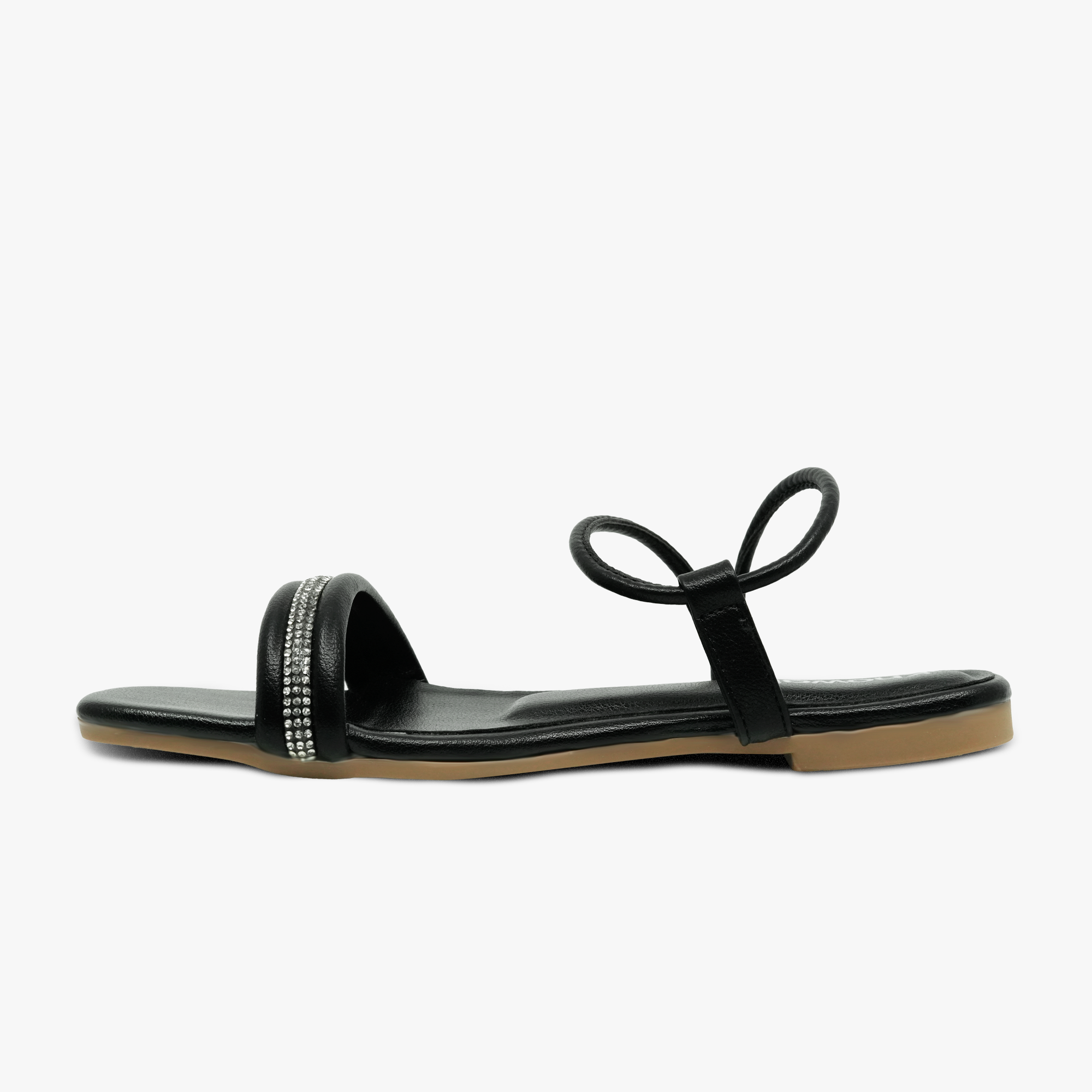 “Profile shot of open-toe black sandals featuring thin ankle strap and padded footbed”