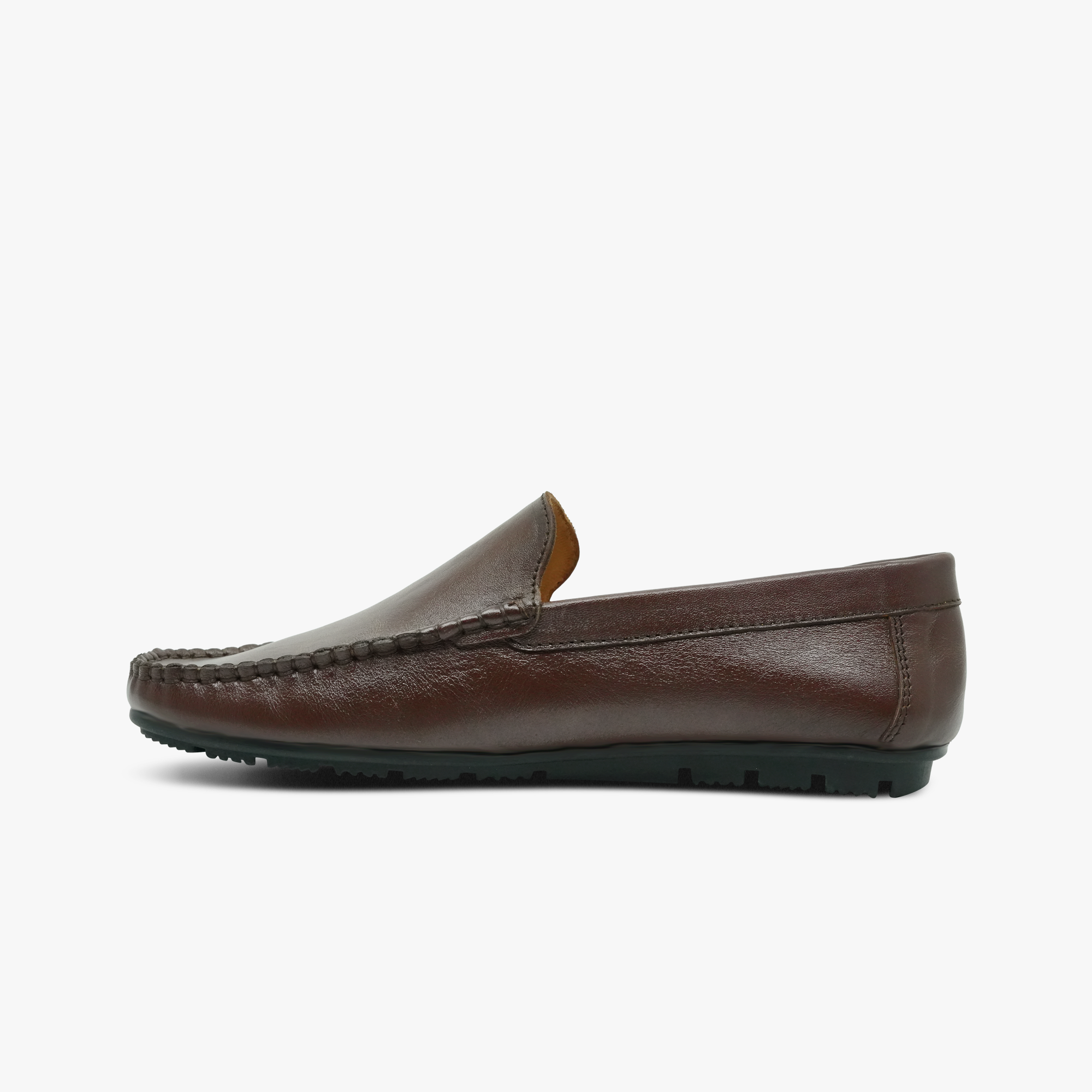 “Profile shot of brown leather driver loafers with moccasin stitching”