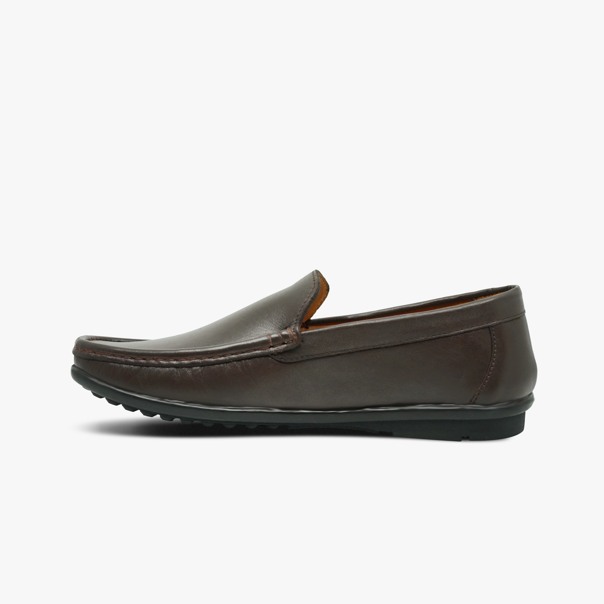 “Profile shot of men’s brown slip-on loafer featuring moccasin stitching”