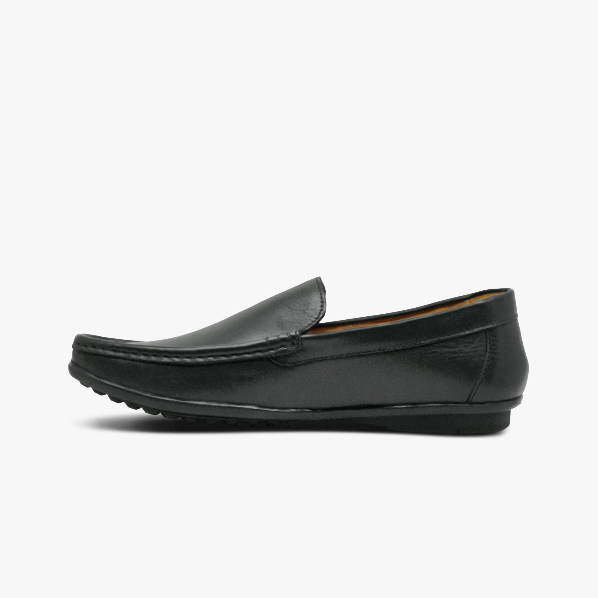 “Profile shot of black leather slip-on loafers with moc-toe design”
