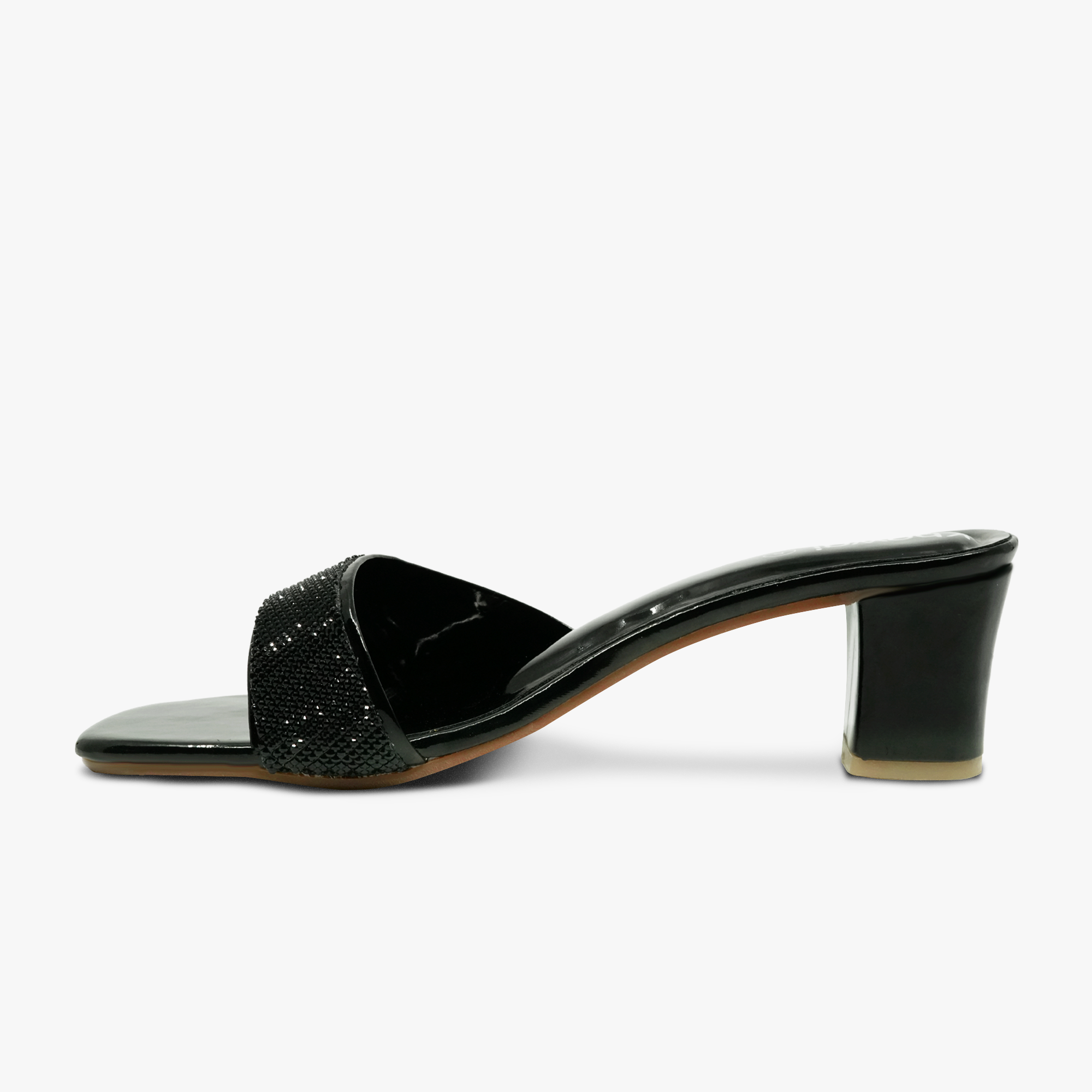 “Profile shot of black slip-on mule sandals featuring a sparkling rhinestone strap”