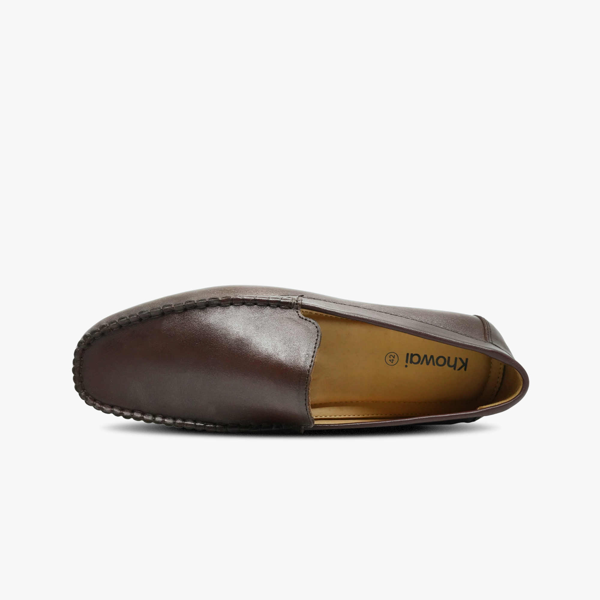 “Top view of cushioned footbed in Khowai brown leather driver loafers”